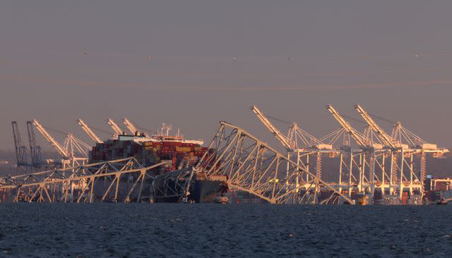 <p>Rob Carr/Getty</p> Rescue efforts are currently being made to find people in the water following the bridge's collapse