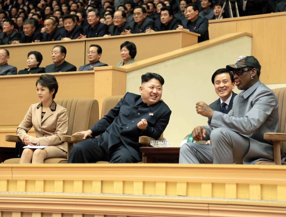 North Korean leader Kim Jong Un watches a basketball game between former U.S. NBA basketball players and North Korean players of the Hwaebul team of the DPRK with Dennis Rodman at Pyongyang Indoor Stadium