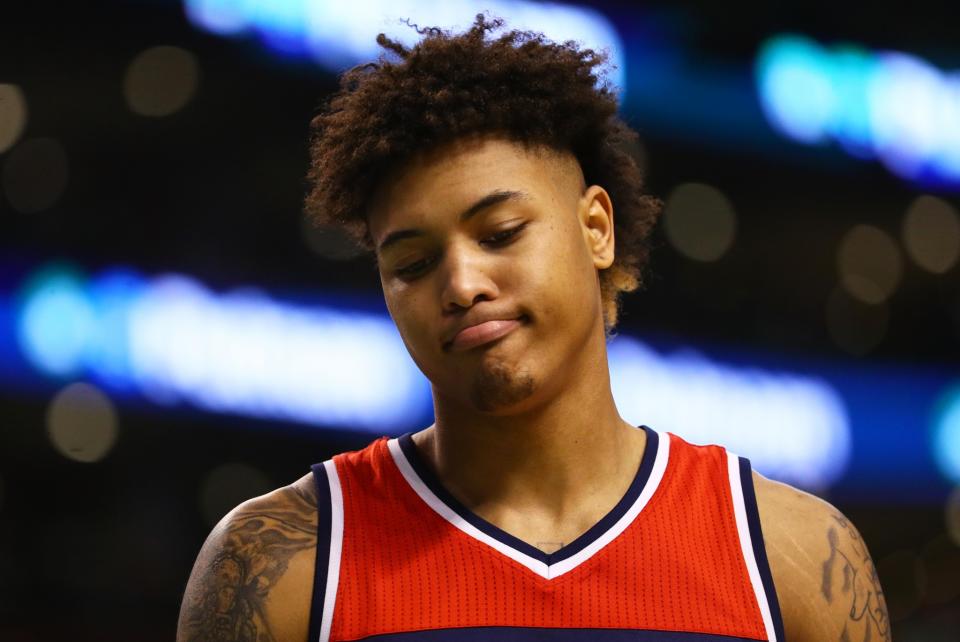 Kelly Oubre wonders if maybe they're saying 'Cut through, Oubre.' Like, suggesting he should move without the ball. Yeah, that's gotta be it. (Getty Images)