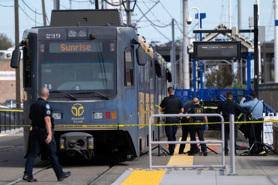 Sacramento Police investigate a shooting with one dead and two hospitalized at the 65th Street light rail station in East Sacramento on Thursday.