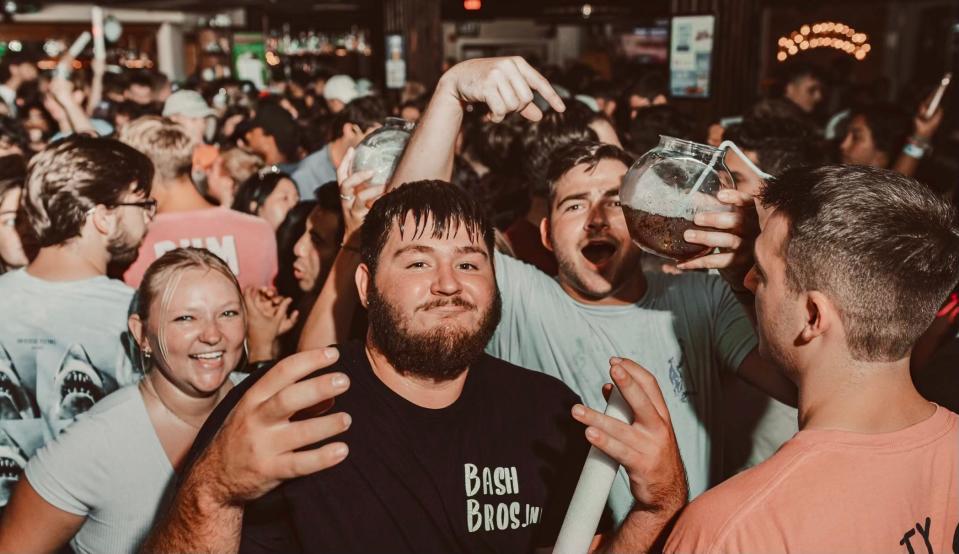 Crowds fill Klondike Kate's on Main Street in Newark for their  32-ounce "mega pint" mixed drinks, which cost $8 on Thursday nights.