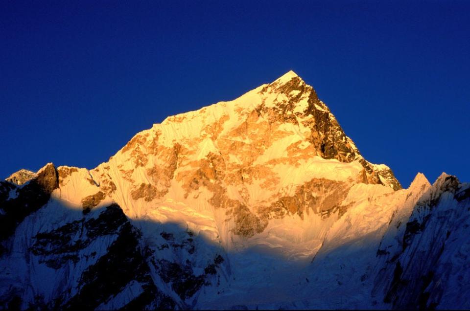 Sunset over Mt. Nuptse and Mt. Lhotse summits.