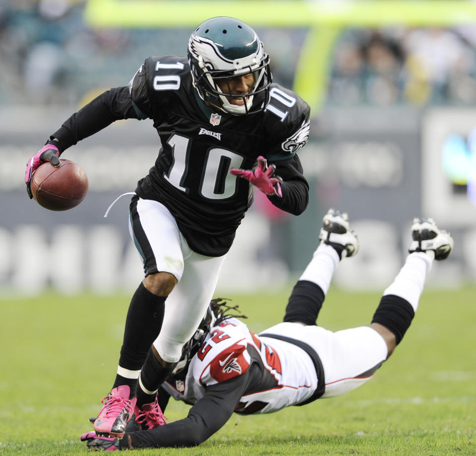 FILE - In this Oct. 28, 2012 file photo shows Philadelphia Eagles wide receiver DeSean Jackson (10) avoiding a tackle by Atlanta Falcons cornerback Asante Samuel (22) during the second half of an NFL football game in Philadelphia. The Washington Redskins made their biggest move yet of the offseason Tuesday night, April 1, 2014, adding three-time Pro Bowl receiver DeSean Jackson less than a week after the dynamic playmaker was released by the rival Philadelphia Eagles. (AP Photo/Michael Perez, File)