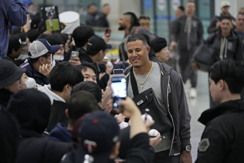 San Diego Padres player Manny Machado interacts with the crowd as he arrives at the Incheon International Airport In Incheon, South Korea, Friday, March 15, 2024. (AP Photo/Ahn Young-joon)