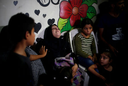 The mother of 11-year-old Palestinian boy Shadi Abdel-Al, who was killed during a protest at the Israel-Gaza border fence, mourns during his funeral in the northern Gaza Strip September 15, 2018. REUTERS/Mohammed Salem