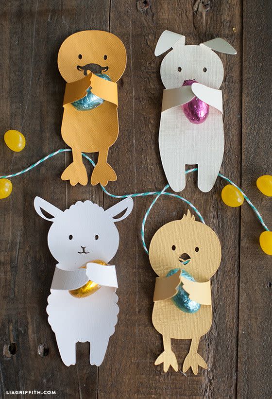 <p>Let kids cut out their favorite animal shapes (or download Lia Griffith's here), then place a candy on them to gift to friends or teachers. </p><p><strong>Get the tutorial at <a href="https://go.redirectingat.com?id=74968X1596630&url=https%3A%2F%2Fliagriffith.com%2Fdiy-easter-candy-huggers%2F&sref=https%3A%2F%2Fwww.countryliving.com%2Fdiy-crafts%2Fhow-to%2Fg1111%2Feaster-crafts%2F" rel="nofollow noopener" target="_blank" data-ylk="slk:Lia Griffith;elm:context_link;itc:0;sec:content-canvas" class="link ">Lia Griffith</a>.</strong></p>