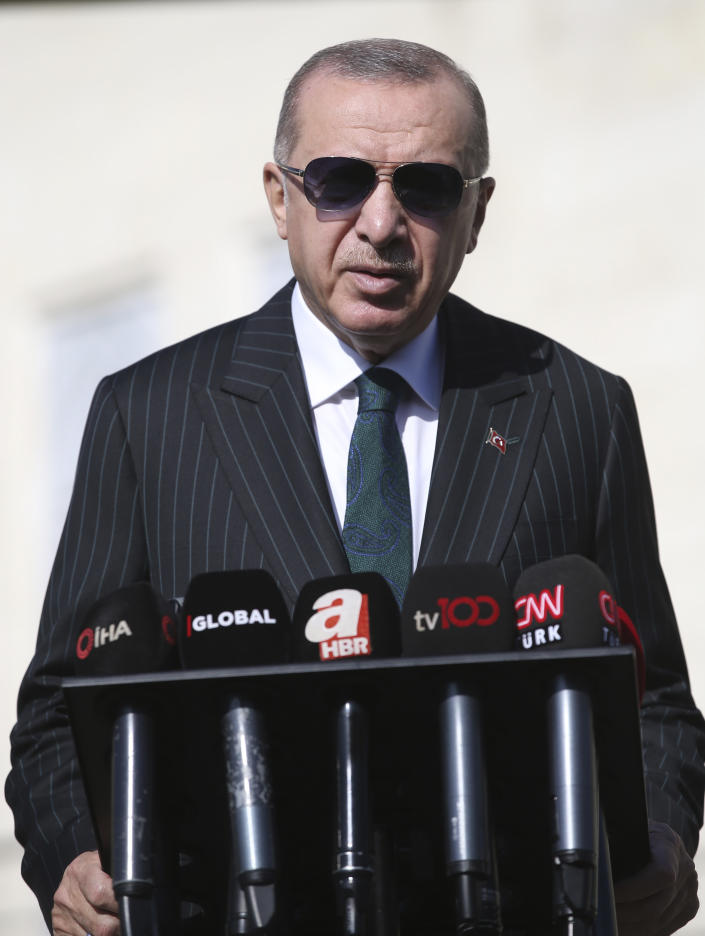 Turkey's President Recep Tayyip Erdogan speaks to the media, in Istanbul, Friday, Oct. 23, 2020. Erdogan confirmed the country tested its Russian-made missile defense system, despite objections from the United States. Speaking after Friday prayers in Istanbul, President Recep Tayyip Erdogan said Turkey had every right to test its equipment. (Turkish Presidency via AP, Pool)