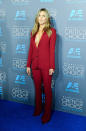 Jennifer Aniston not only wore colour, she wore pants on the red carpet! At the People's Choice Awards, the actress wore Gucci suit, without a shirt on underneath, accessorised with some sexy boob jewellery.