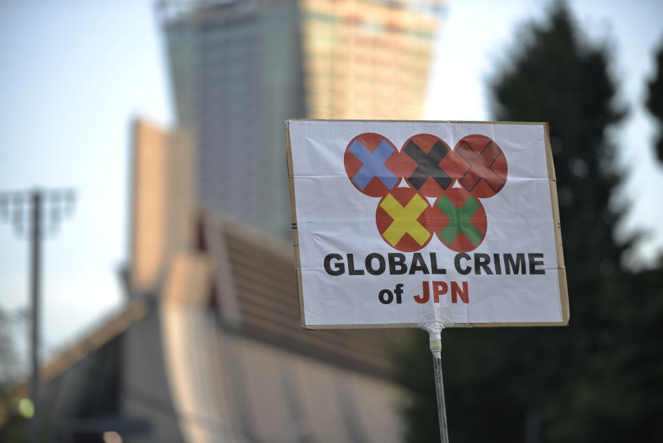 <p>People protest against the Opening ceremony of 2020 Tokyo Summer Olympic Games on July 23, 2020 in Tokyo, Japan, as they ask for the cancel of the Games a few hours ahead of the Opening ceremony of the Tokyo Games. (Photo by David MAREUIL/Anadolu Agency via Getty Images)</p> 