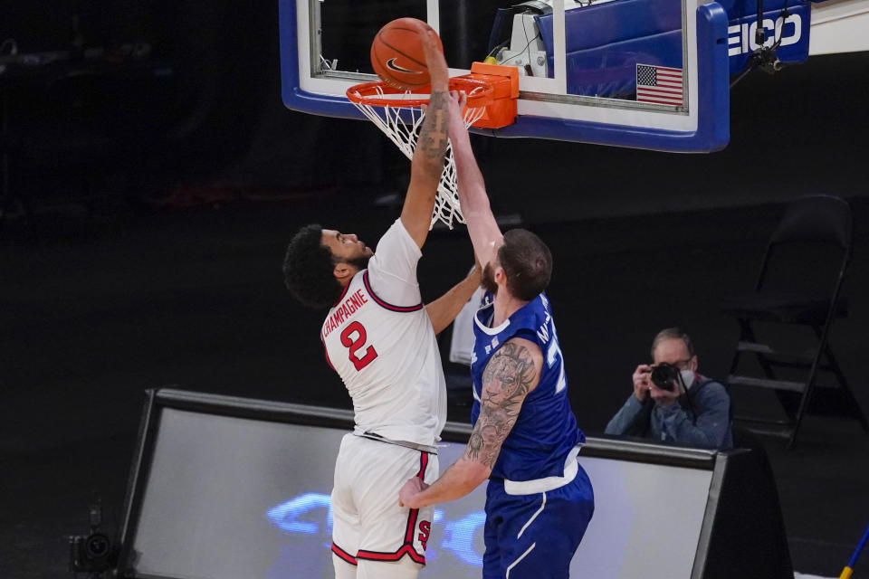 Seton Hall forward Sandro Mamukelashvili (23) goes to the basket against St. John's guard Julian Champagnie (2) during the second half of an NCAA college basketball game in the quarterfinals of the Big East conference tournament, Thursday, March 11, 2021, in New York. (AP Photo/Mary Altaffer)