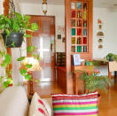 A jharokha-inspired, stained-glass divider sections off the entrance from the dining area.