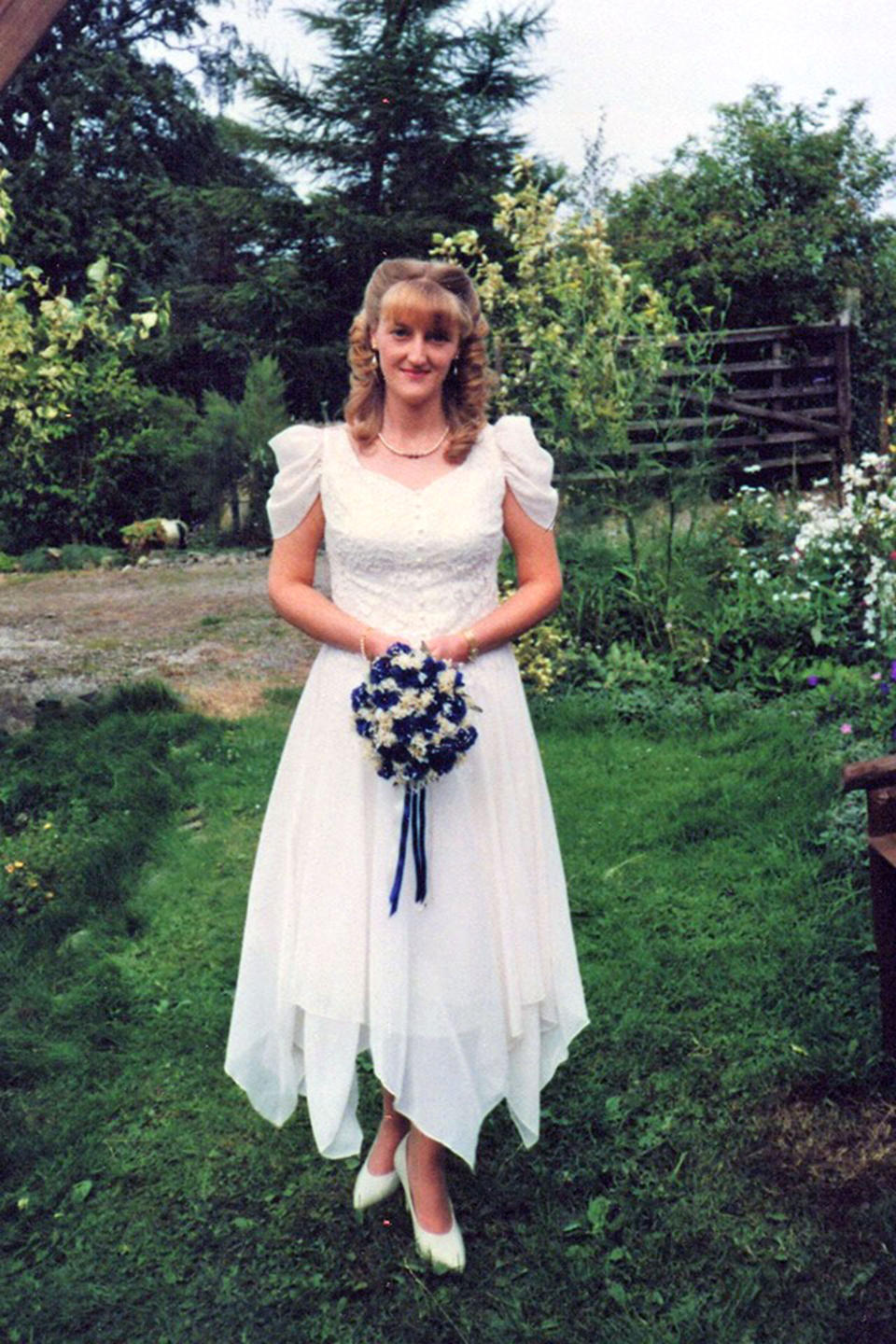 Her mother photographed in the sentimental gown her wedding day [Photo: Caters]