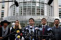 Supporters of NXIVM cult leader Keith Raniere, speak to reporters following the sentencing hearing in the sex trafficking and racketeering case against Raniere, outside the Brooklyn Federal Courthouse in New York