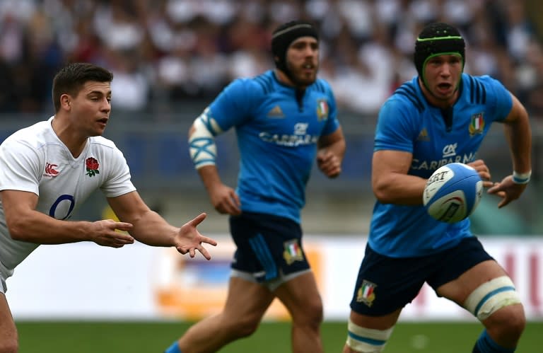 England's scrum-half Ben Youngs (L) takes the ball as his team hammer Italy in Rome on February 14, 2016