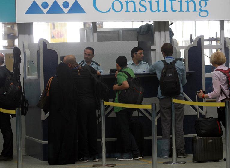 Travelers wait at Sanaa International Airport as hundreds of foreigners were evacuated from the Yemeni capital due to security reasons on March 28, 2015 after the third day of Saudi-led coalition airstrikes against Shiite Huthi rebels