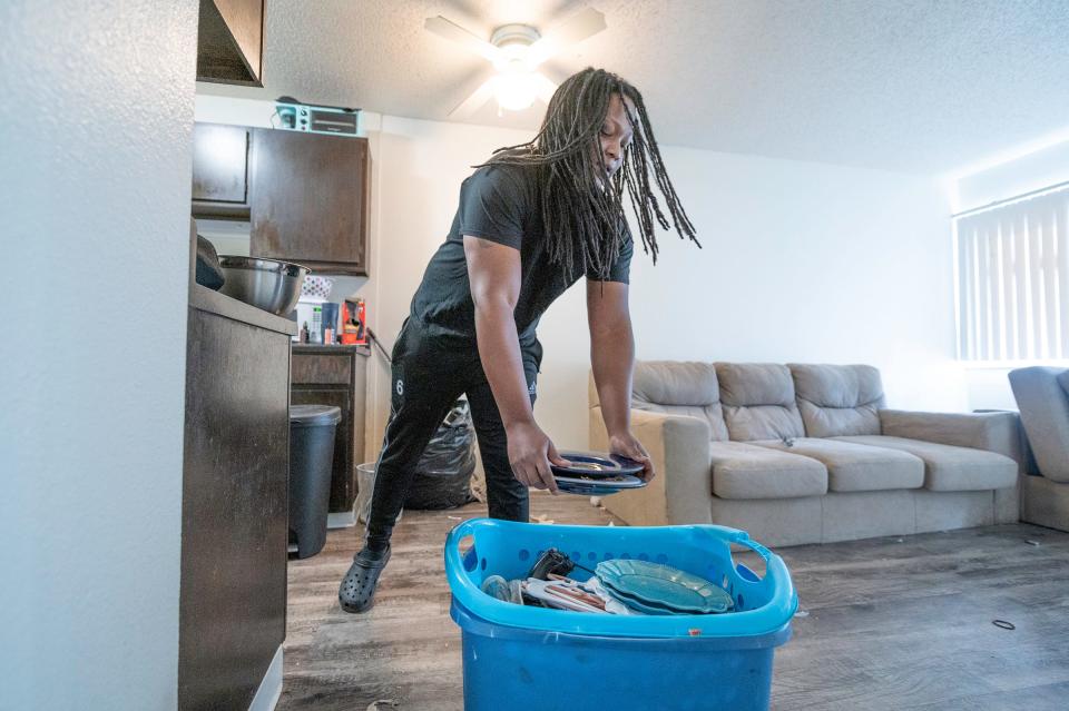 Markus Miller packs up belongings after being forced to vacate Skyview Apartments due to damage of the buildings heating and sewer systems.