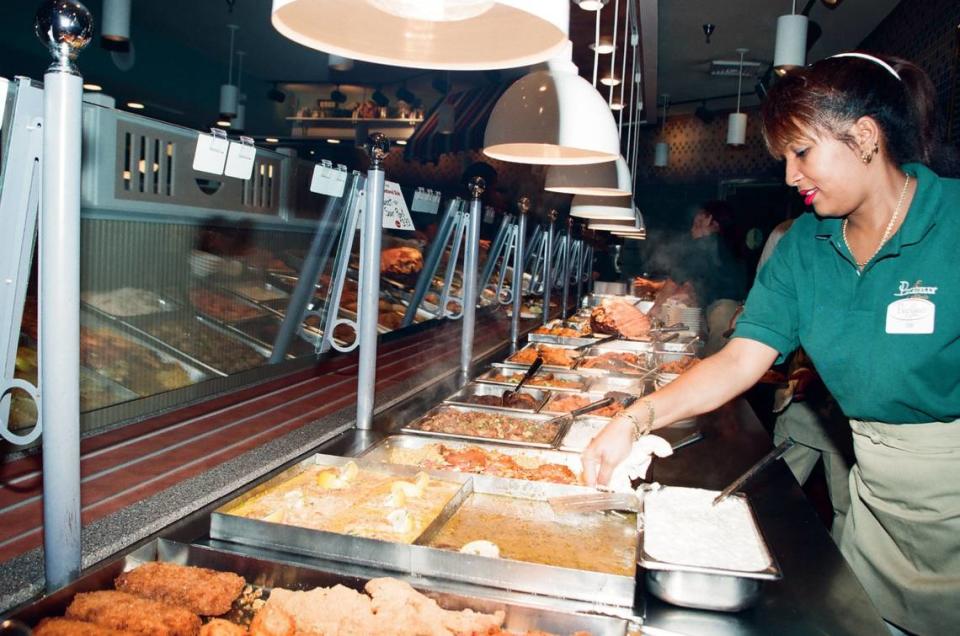 Workers prepare the buffet at Piccadilly Cafeteria. Miami Herald File