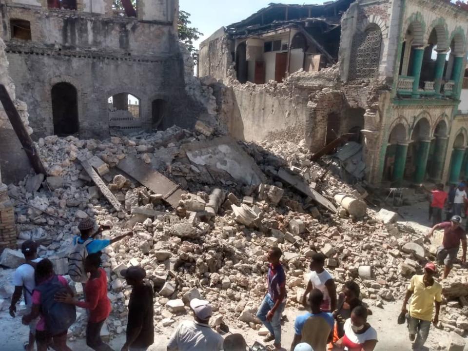 JEREMIE, HAITI - AUGUST 14: A photo shows damaged buildings as people inspect after a 7.2 magnitude earthquake struck the country on August 14, 2021, in Jeremie, Haiti. The earthquake's epicenter was 12 kilometers (7.5 miles) northeast of Saint-Louis-du-Sud, with a depth of 10 kilometers (6 miles). (Photo by Stringer/Anadolu Agency via Getty Images)