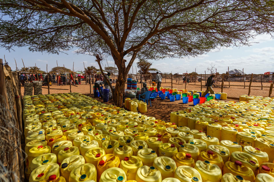 Jerricans, used for storing water, shortly before being disbursed to displaced families by the nongovernment organization World Vision International. Some 15,000 displaced Somali families live in the Kaxarey settlement, located less than a mile from the Ethiopian border. (Giles Clarke)