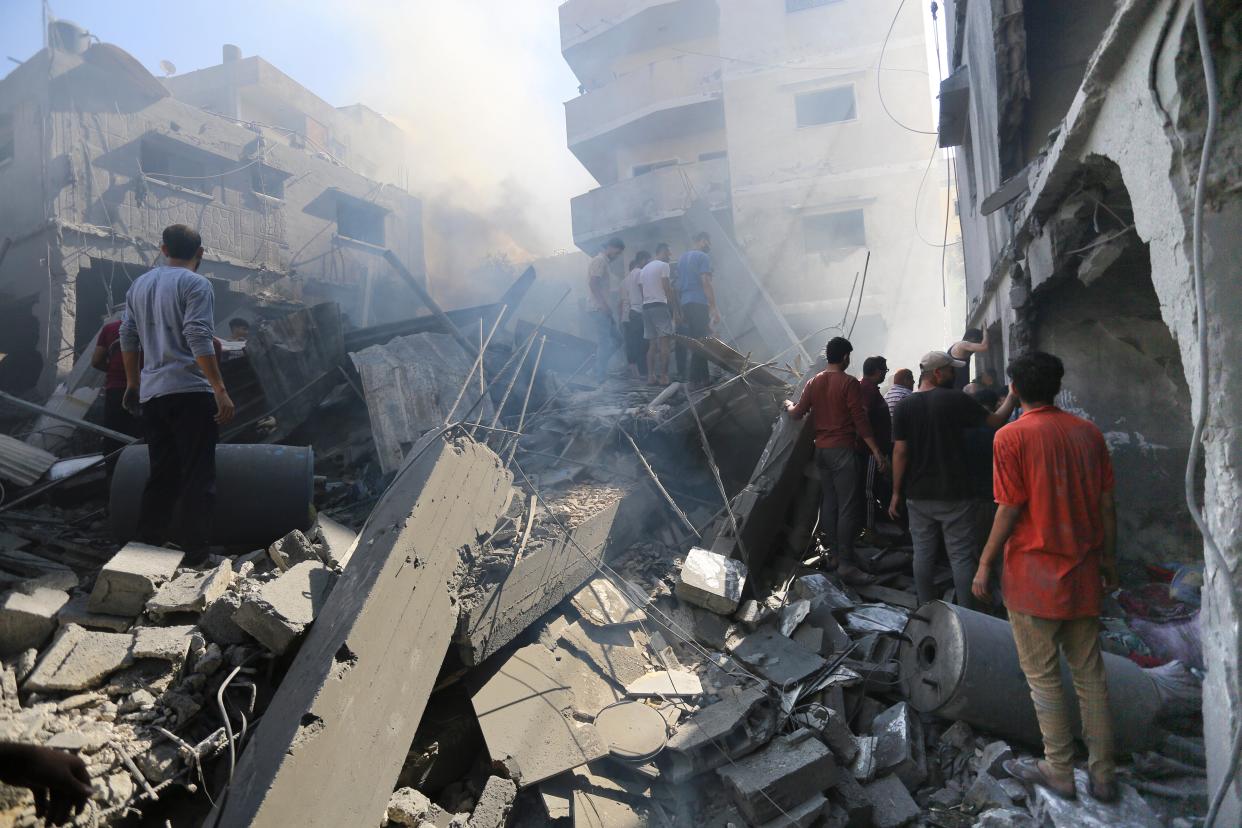 Palestinians look for survivors after Israeli airstrikes in Gaza City (Copyright 2023 The Associated Press. All rights reserved.)