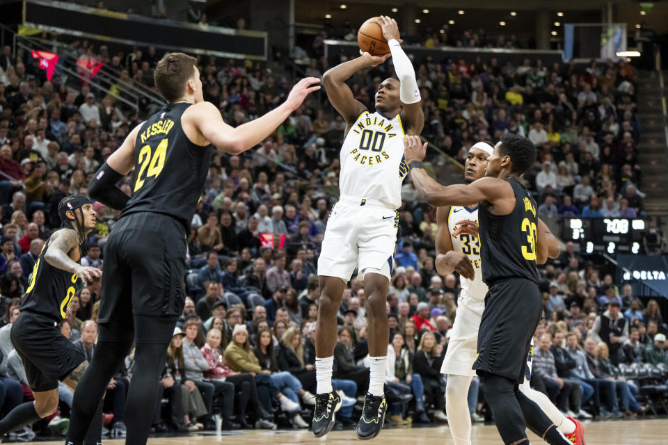 Indiana Pacers guard Bennedict Mathurin (00) goes up to shoot over Utah Jazz center Walker Kessler (24) during the first half of an NBA basketball game Monday, Jan. 15, 2024, in Salt Lake City. (AP Photo/Spenser Heaps)