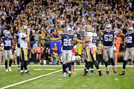 Oct 4, 2015; New Orleans, LA, USA; Dallas Cowboys defensive back Tyler Patmon (26) celebrates after New Orleans Saints kicker Zach Hocker (2) misses a field goal during the fourth quarter pushing the game to overtime at the Mercedes-Benz Superdome. Derick E. Hingle-USA TODAY Sports