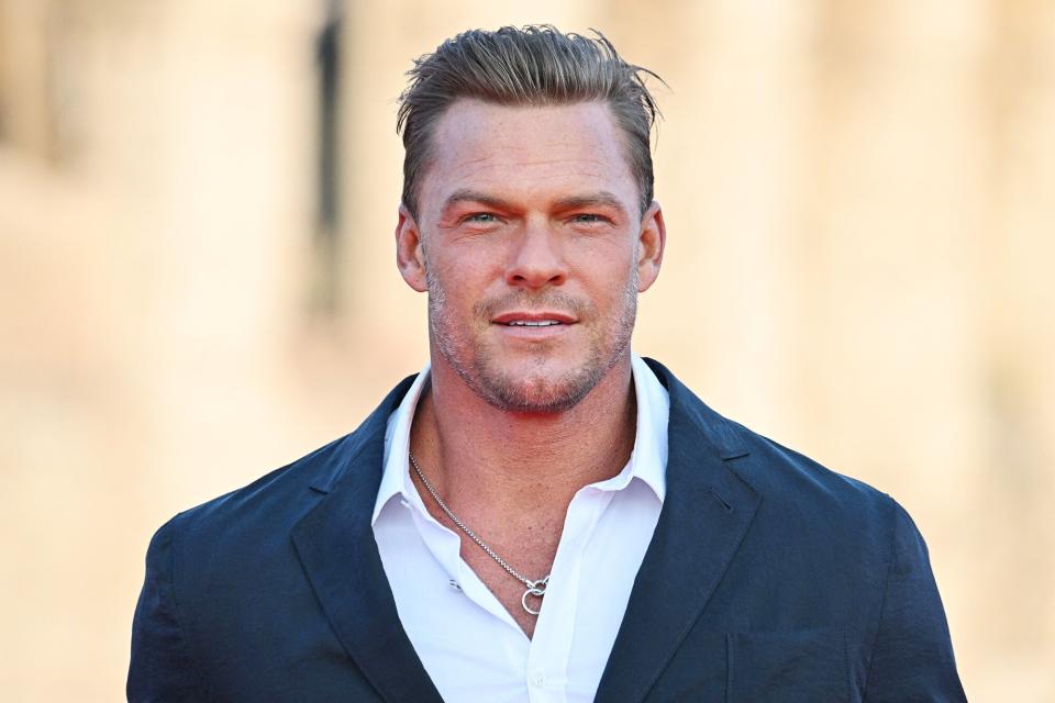 US actor and singer Alan Ritchson arrives for the Premiere of the film "Fast X", the tenth film in the Fast & Furious Saga, on May 12, 2023 at the Colosseum monument in Rome. (Photo by Alberto PIZZOLI / AFP) (Photo by ALBERTO PIZZOLI/AFP via Getty Images)