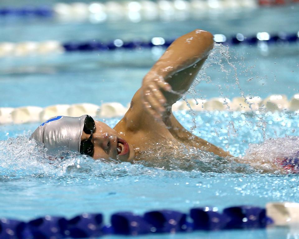 North Quincy/ Quincy’s Kenny Guan competes in the 400 yard freestyle relay race in their meet against Hanover/ Marshfield at Lincoln-Hancock Pool on Thursday, Dec. 16, 2021.