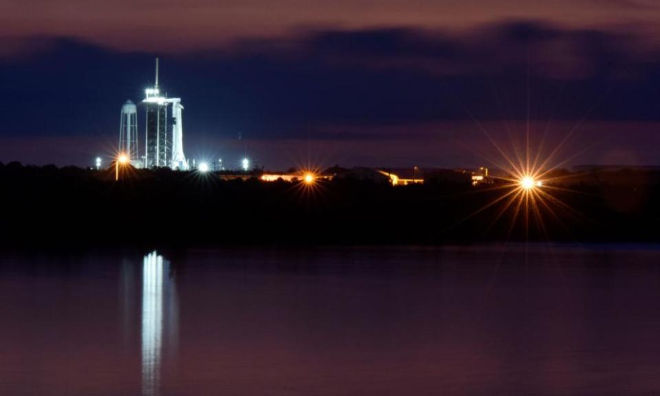 The SpaceX Crew Dragon spacecraft on a Falcon 9 booster rocket sits at sunrise on Pad39A at the Kennedy Space Center in Cape Canaveral on Friday.