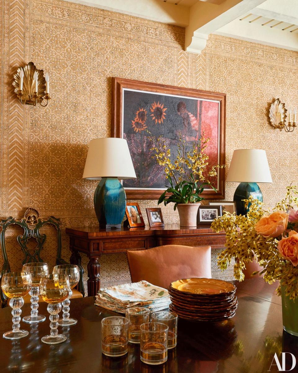 In the dining room, SCDS lamps flank a work by Walter Williams.