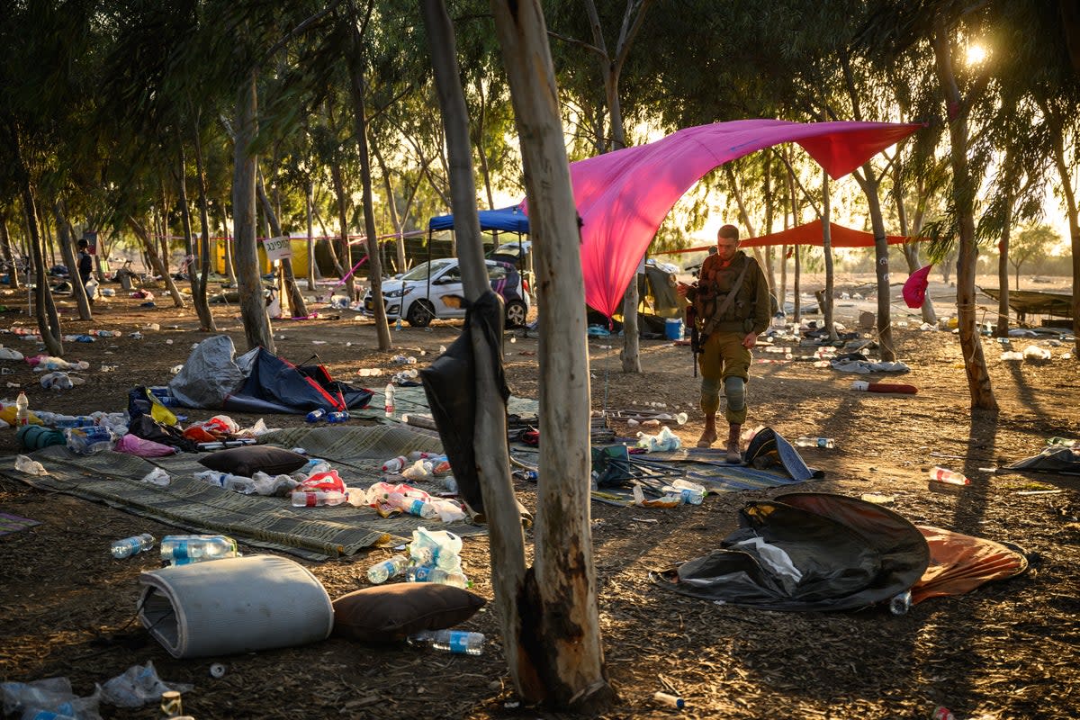 Search at the Israel festival site for survivors and personal effects (Getty Images)