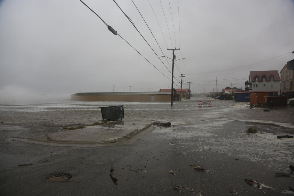 Water surrounds the mini convention center, which is also home to the finish of the Iditarod Trail Sled Dog Race, in Nome, Alaska, on Saturday, Sept. 17, 2022. Much of Alaska's western coast could see flooding and high winds as the remnants of Typhoon Merbok moved into the Bering Sea region. The National Weather Service says some locations could experience the worst coastal flooding in 50 years. (AP Photo/Peggy Fagerstrom)