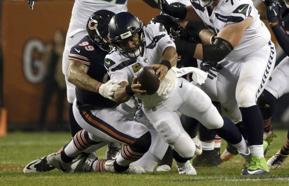 Chicago Bears linebacker Aaron Lynch (99) sacks Seattle Seahawks quarterback Russell Wilson (3) during the first half of an NFL football game Monday, Sept. 17, 2018, in Chicago. (AP Photo/David Banks)