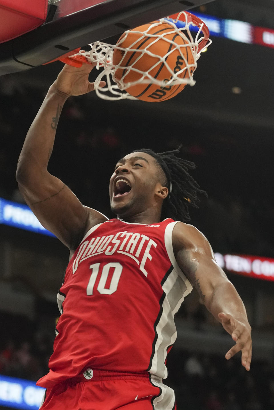 Ohio State's Brice Sensabaugh (10) dunks during the first half of an NCAA college basketball game against Iowa at the Big Ten men's tournament, Thursday, March 9, 2023, in Chicago. (AP Photo/Erin Hooley)