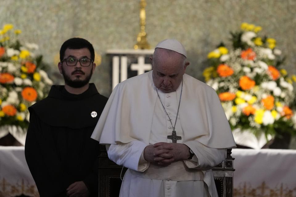 Pope Francis attends a ceremony at the Maronite Cathedral of Our Lady of Graces in Nicosia, Cyprus, Thursday, Dec. 2, 2021. Pope Francis' trip to Cyprus and Greece is drawing new attention to the plight of migrants on Europe's borders and the disconnect between Francis' Gospel-driven call for countries to welcome and integrate them and front-line governments that are increasingly unwilling or unable to let them in. (AP Photo/Alessandra Tarantino)