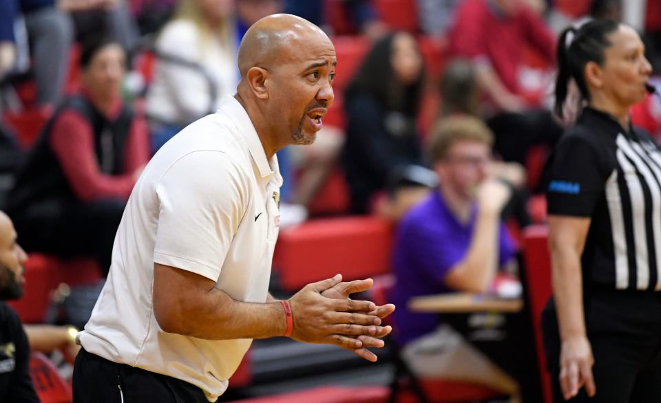 Cardinal Mooney Catholic second-year girls basketball coach Marlon Williams instructs his players against Tampa Catholic in the Class 3A-Region 3 final Thursday at Patterson Pavilion in Sarasota.
