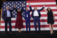 From left, Attorney General of Virginia Mark Herring, Virginia democratic lieutenant governor candidate Del. Hala Ayala, President Joe Biden, Virginia democratic gubernatorial candidate Terry McAuliffe and his wife Dorothy McAuliffe stand on stage during a campaign event at Lubber Run Park, Friday, July 23, 2021, in Arlington, Va. (AP Photo/Andrew Harnik)