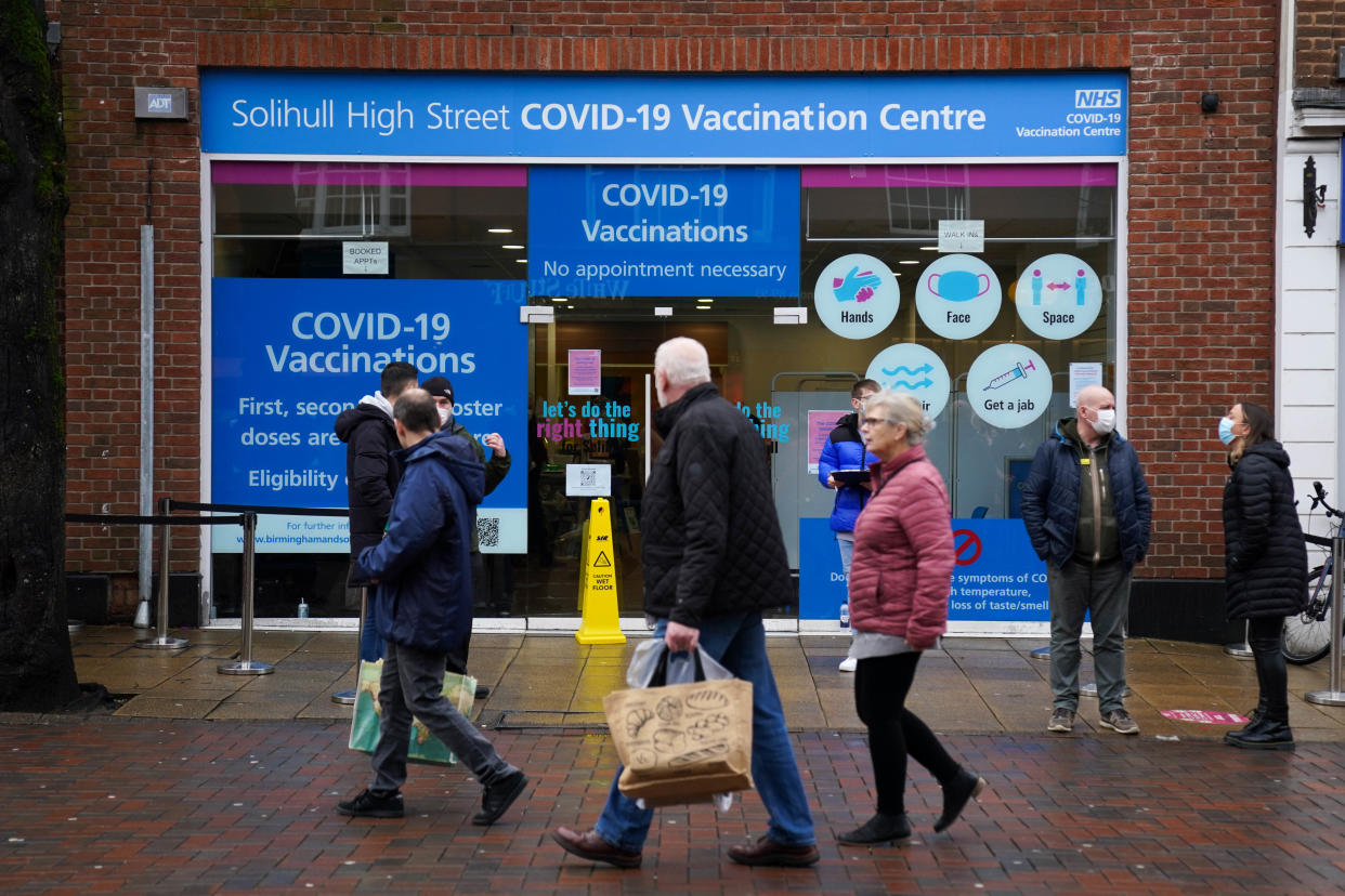 Shoppers pass a Covid-19 vaccination centre in Solihull town centre. Prime Minister Boris Johnson has said that the vaccination campaign has allowed England to maintain its current level of coronavirus controls. Picture date: Wednesday December 29, 2021. (Photo by Jacob King/PA Images via Getty Images)