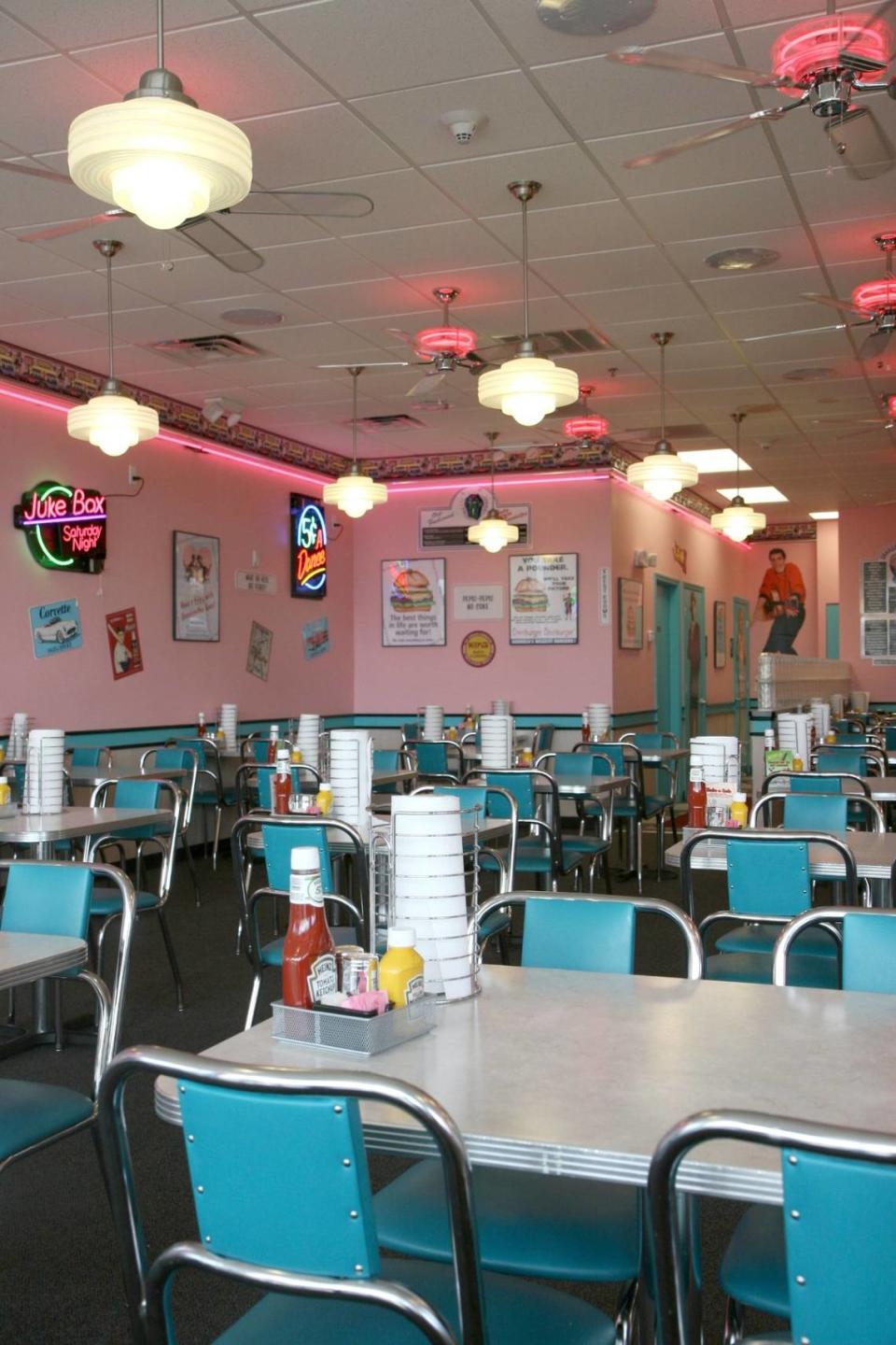 Ample seating and funky retro decor could be seen at the Cheeburger Cheeburger in Bradenton. Table settings included a selection of trivia cards to pass the time.