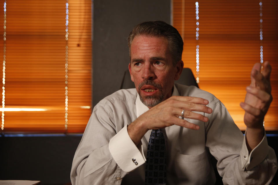 FILE - Brian McIntyre, Cochise County Attorney, speaks during an interview in his office in Bisbee, Ariz., on Oct. 29, 2021. An Arizona judge has ruled that the Church of Jesus Christ of Latter-day Saints may not use the state's “clergy-penitent privilege” to refuse to answer questions or turn over documents in a child sex-abuse case. (AP Photo/Dario Lopez-Mills, File)