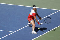 Ons Jabeur, of Tunisia, returns a shot to Shelby Rogers, of the United States, during the second round of the U.S. Open tennis championships, Friday, Sept. 2, 2022, in New York. (AP Photo/Jason DeCrow)