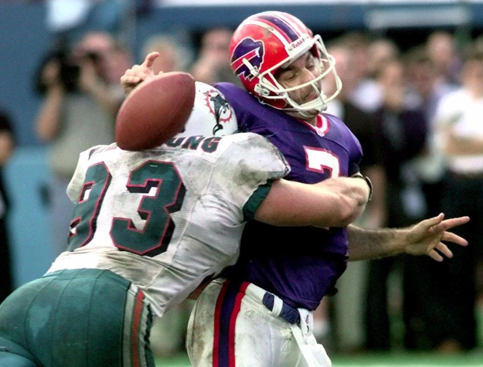 Miami's Trace Armstrong nails Doug Flutie and forces a fumble that secured the Dolphins 1998 wild-card victory.