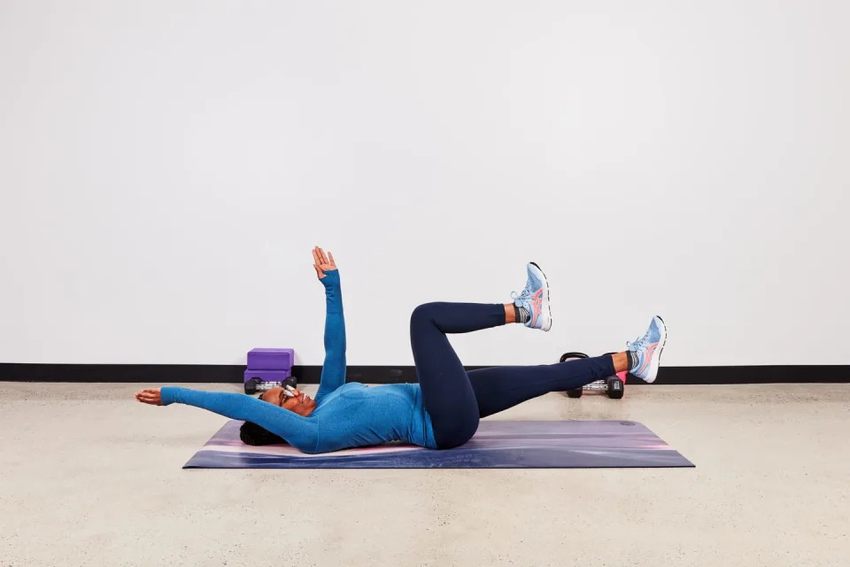 monique doing a dead bug exercise for fitness