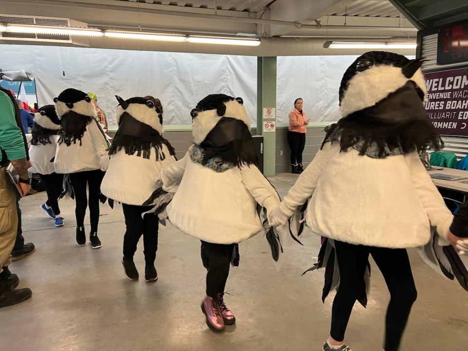 Some AWG 2024 mascots in full costume. The chickadee is the official ambassador animal for the games this year.