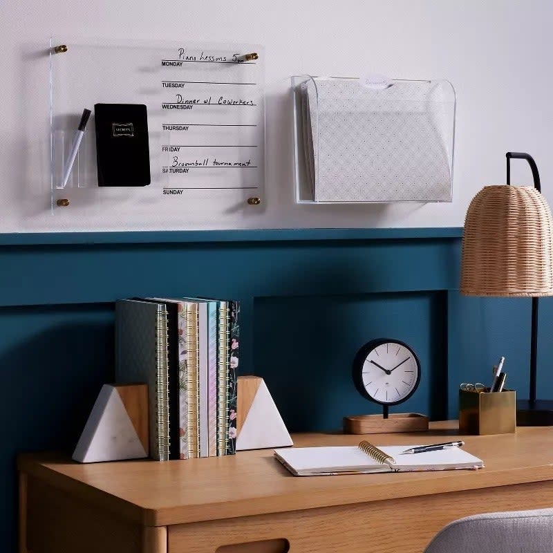 the wood and marble book ends in use on a desk