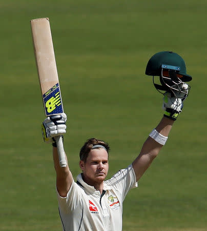 Cricket - India v Australia - First Test cricket match - Maharashtra Cricket Association Stadium, Pune, India - 25/02/17. Australia's captain Steve Smith celebrates his century. REUTERS/Danish Siddiqui