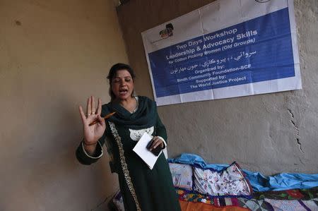 Beena Hussain, a trainer, gestures while speaking to women cotton pickers during a leadership and advocacy skills workshop organised by the Sindh Community Foundation (SCF), in Meeran Pur village, north of Karachi November 23, 2014. REUTERS/Akhtar Soomro