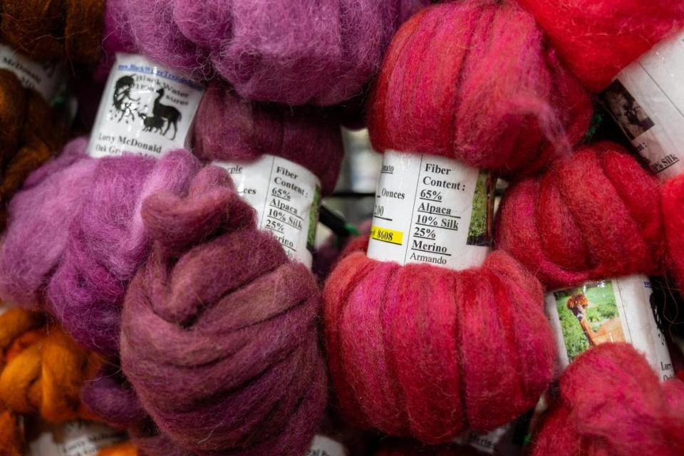 Lorry McDonald of Oak Grove, Missouri, had alpaca wool yarn for sale at her booth, Black Water Treasures, at the MOPACA Invitational Alpaca Show 2024 at Hale Arena on Friday, March 22, 2024, in Kansas City. McDonald is a master spinner and spins and dyes the alpaca fiber. Tammy Ljungblad/tljungblad@kcstar.com