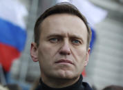 FILE - In this Saturday, Feb. 29, 2020 file photo, Russian opposition activist Alexei Navalny takes part in a march in memory of opposition leader Boris Nemtsov in Moscow, Russia. Russian opposition leader Alexei Navalny was the victim of an attack and poisoned with the Soviet-era nerve agent Novichok, the German government said Wednesday, Sept. 2, citing new test results. Navalny, a politician and corruption investigator who is one of Russian President Vladimir Putin's fiercest critics, fell ill on a flight back to Moscow from Siberia on Aug 20 and was taken to a hospital in the Siberian city of Omsk after the plane made an emergency landing. (AP Photo/Pavel Golovkin, File)