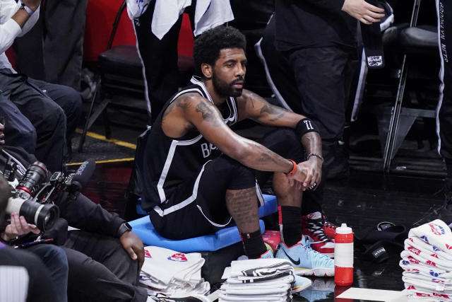 Brooklyn Nets guard Kyrie Irving (11) talks with Boston Celtics center  Tacko Fall (99) after their Game 5 during an NBA basketball first-round  playoff series, Tuesday, June 1, 2021, in New York.